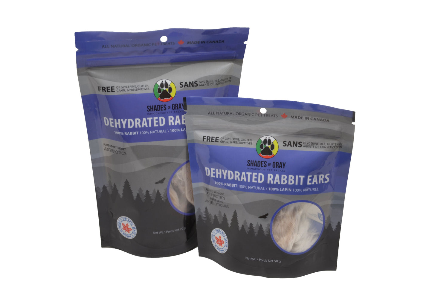 Front view of two bags of different sizes of Shades of Gray Indigenous Pet Treats Dehydrated Rabbit Ears pet treats package, featuring the Made in Ontario logo and brand logo
