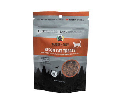 Front of Shades of Gray IndigenousPet Treats Bison Cat Treats packaging in sleek Brown/ black and grey resealable pouch, featuring bold “BISON CAT TREATS” lettering, “Single Ingredient” callout, clear window showing small pieces of dehydrated bison cat treats, Made in Ontario badge, Canadian flag, and circular Shades of Gray Indigenous Pet Treats logo.