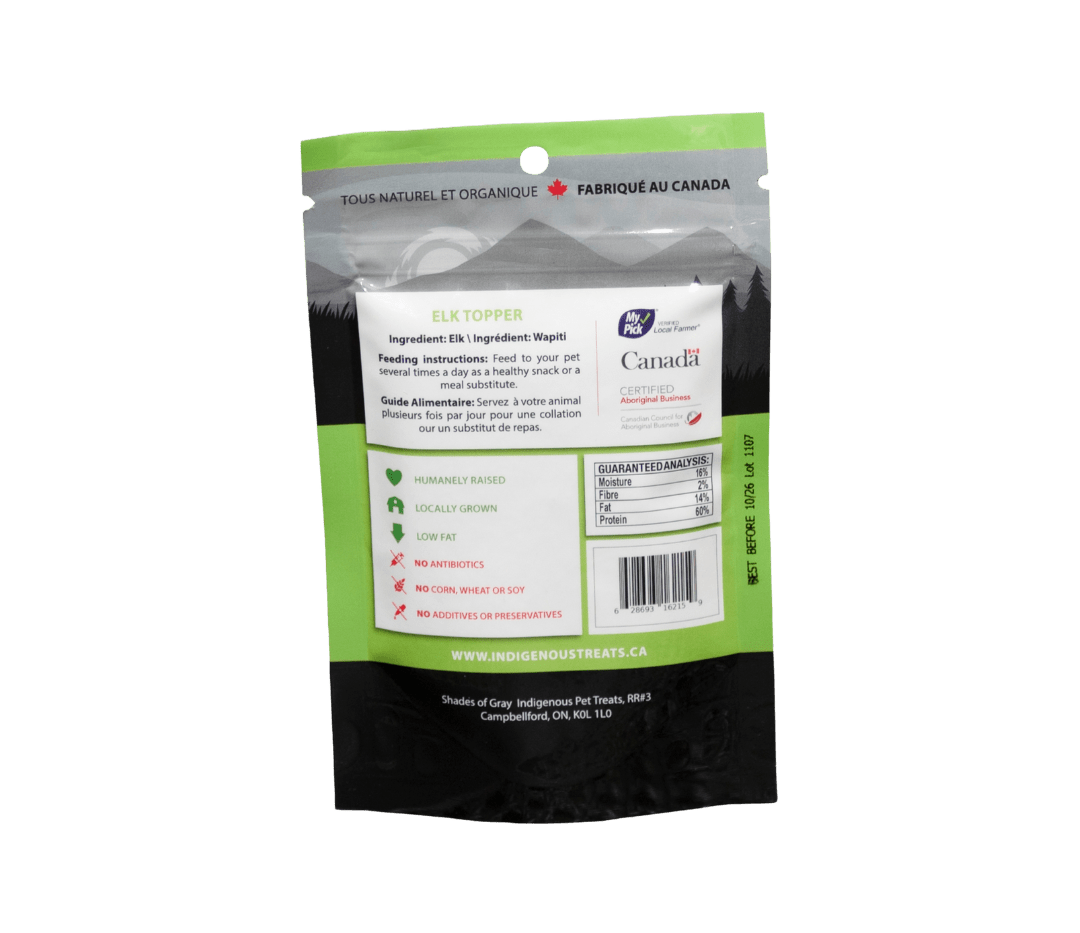 Back of Shades of Gray Indigenous Pet Treats Elk Topper packaging showing single ingredient (100% elk), guaranteed analysis, feeding guidelines for dogs and cats, storage instructions, on clean black text on white background.