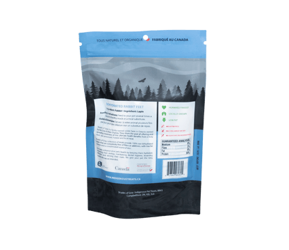 Close-up of Back of packing for Shades of Gray Indigenous Pet Treats Rabbit Feet – ethically sourced, whole dehydrated Canadian rabbit feet with natural fur, 100% single-ingredient, rich in glucosamine and chondroitin, acts as a natural toy and chew for dogs and cats. Shows feeding instructions and Nutritional content.