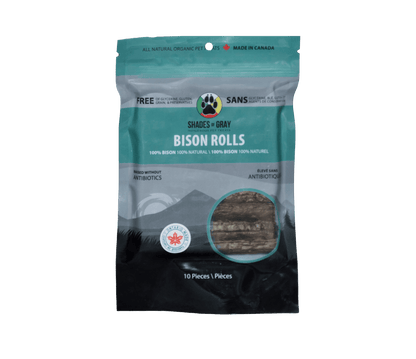 Front of a teal Shades of Gray Bison Rolls resealable bag, 10 pieces, with a window showing single-ingredient dehydrated bison rolls. 100% bison, raised without antibiotics, Ontario Made. This is the resealable bag in the Bison Rolls Eco Refill, ready to top up from the 30-roll refill pouch.